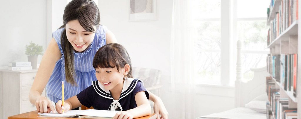 A tutor guiding her student through a lesson