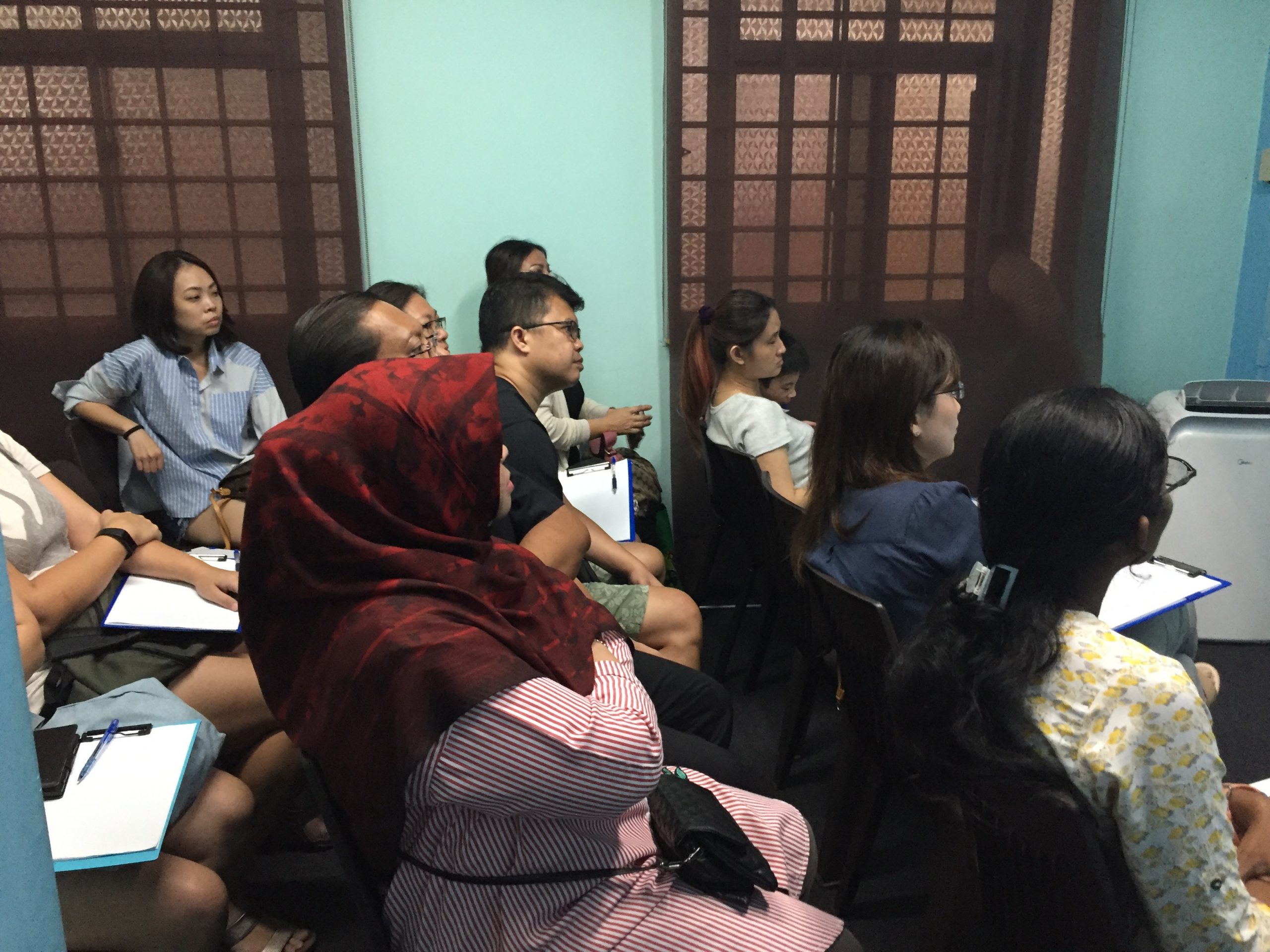 Parent and students attentively listening at Stepping Stones Learning Centre