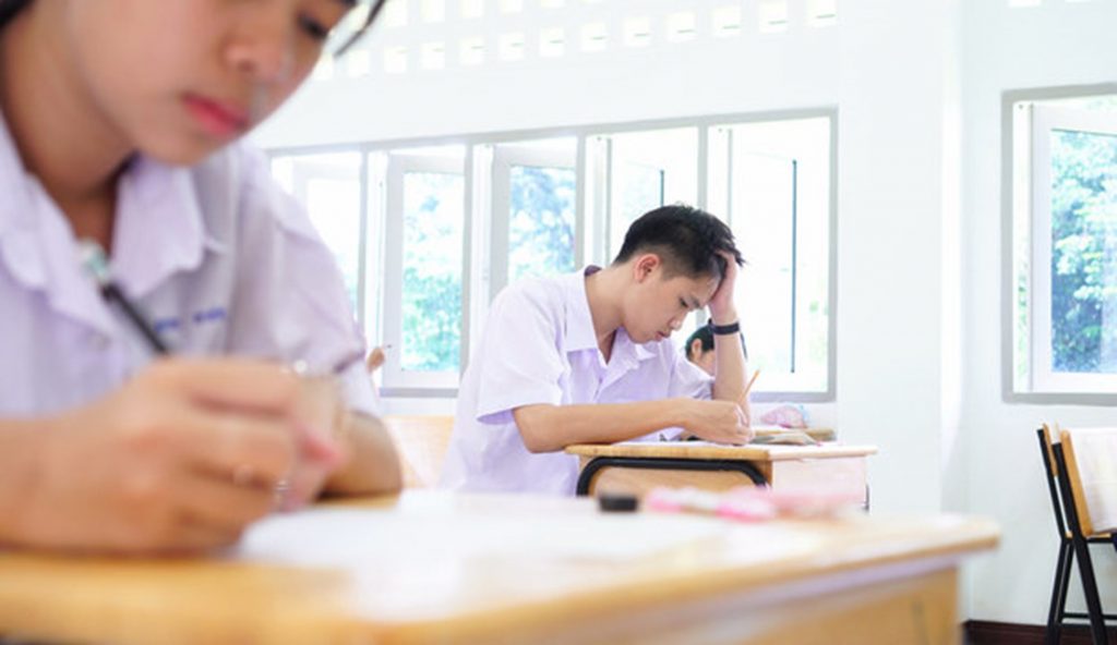 Focused students writing notes