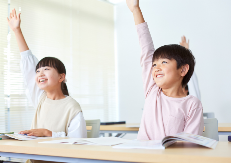 Students confidently raising hands in class, ready to answer.