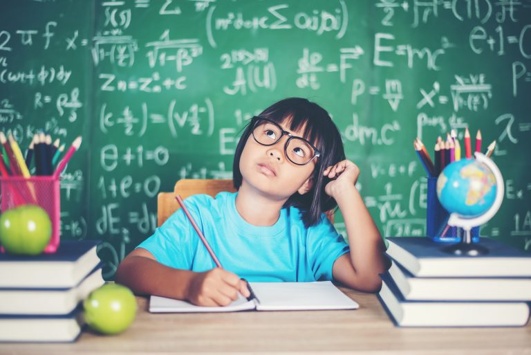 A student studying Math in classroom