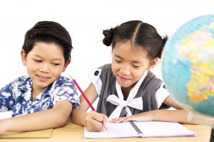 Two children studying together