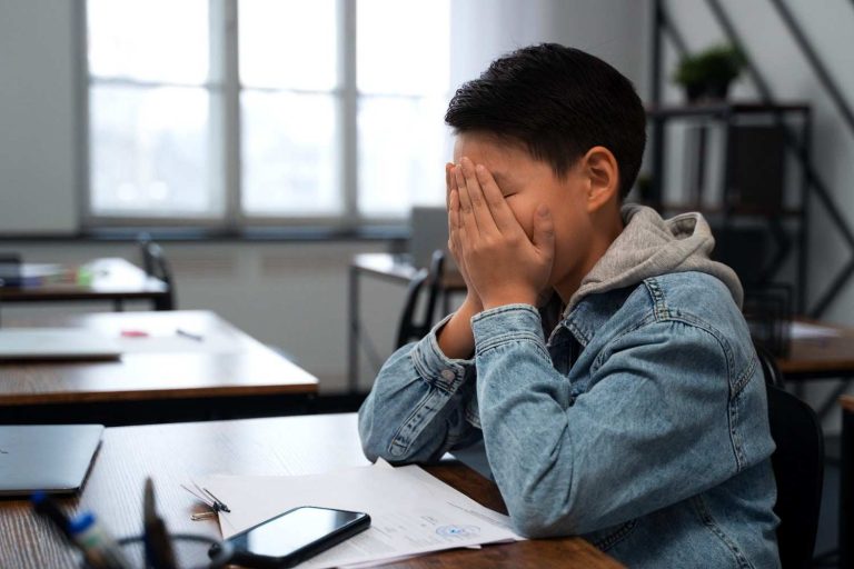 Young boy feeling sad at school