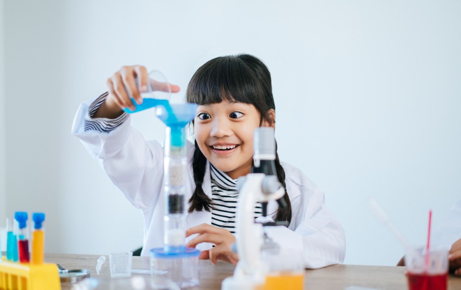 Young girl doing a science experiment